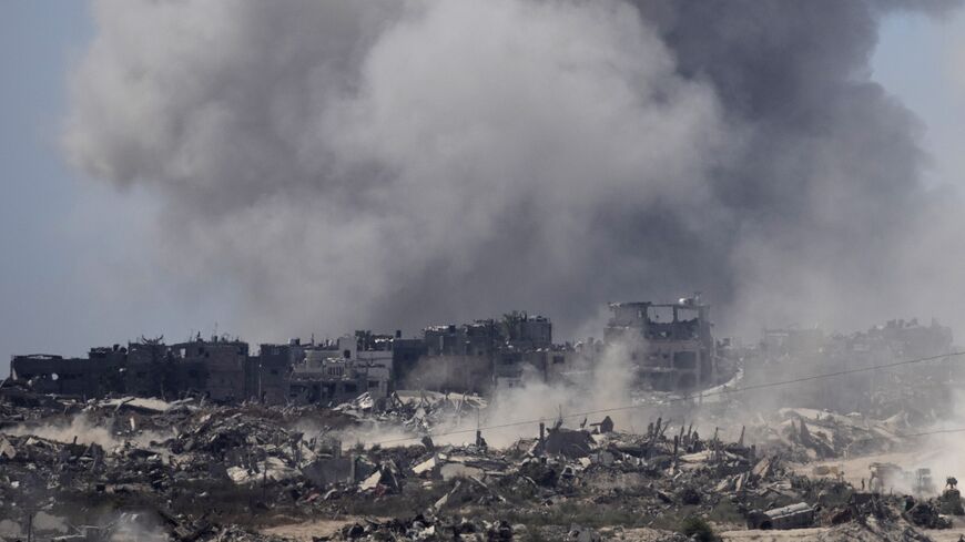 Smoke rise over the Gaza Strip after an Israeli bombardment as seen from a position on the Israeli side of the border on July 3, 2024 in Southern Israel.